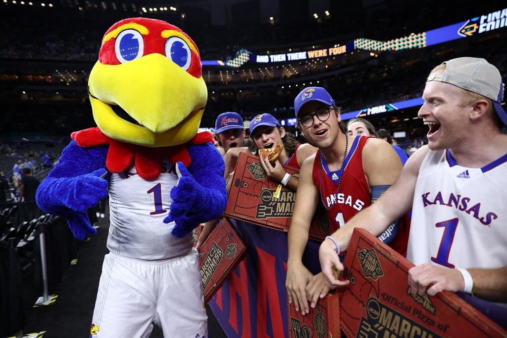 Kansas Jayhawks mascot posses with fans during March Madness