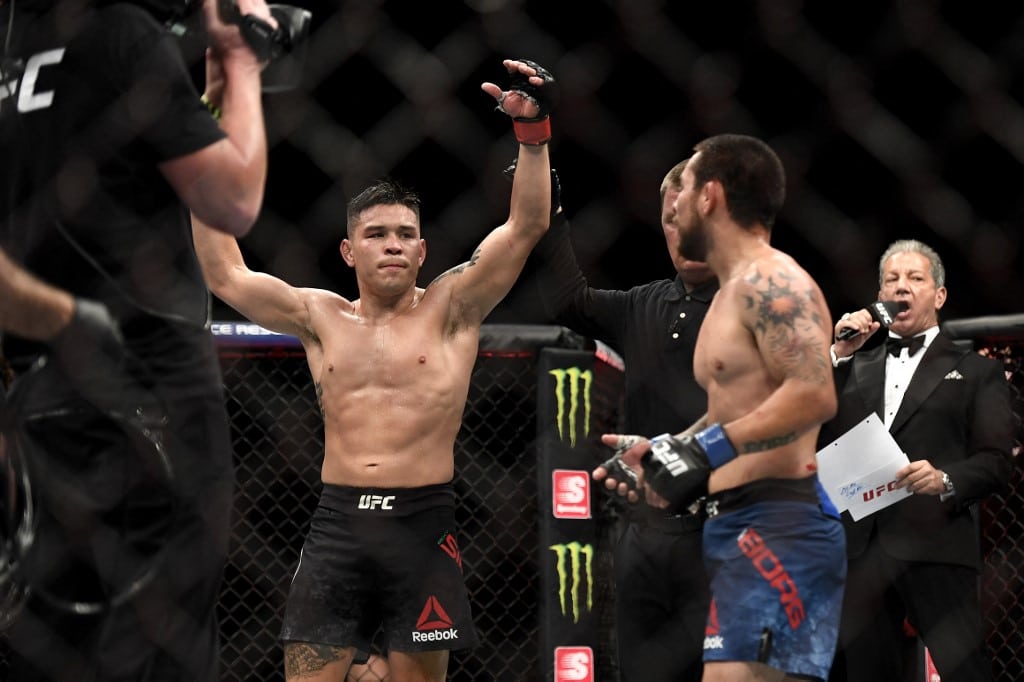 Ricky Simon of United States Celebrates Ray Borg