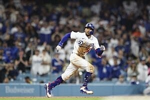 Mookie Betts #50 of the Los Angeles Dodgers gets caught between second and third base in the eleventh inning against the San Francisco Giants