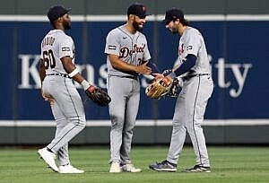 Outfielders Akil Baddoo #60, Riley Greene #31 and Matt Vierling #8 of the Detroit Tigers celebrate after defeating the Kansas City Royals.