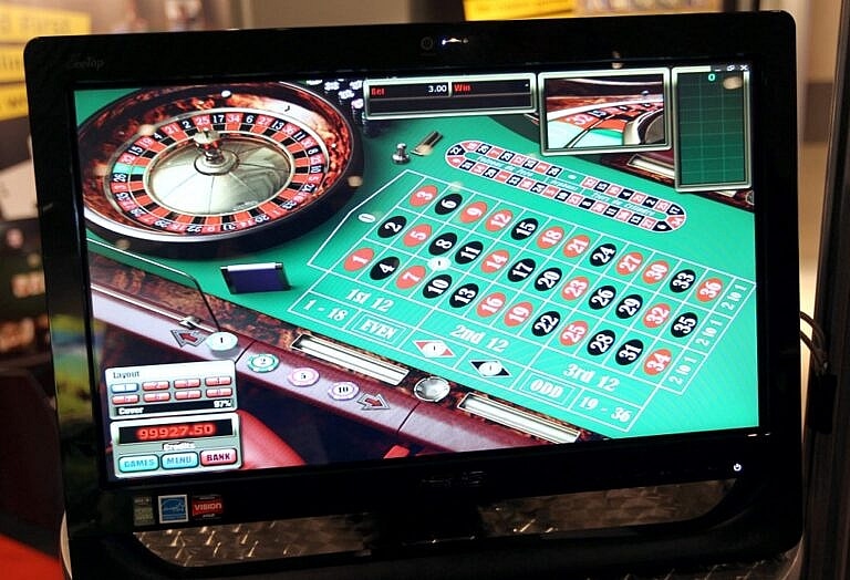 A screen broadcasts a virtual roulette table.