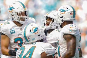 De'Von Achane #28 of the Miami Dolphins celebrates after his touchdown during the fourth quarter against the Denver Broncos