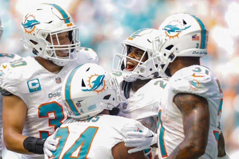 De'Von Achane #28 of the Miami Dolphins celebrates after his touchdown during the fourth quarter against the Denver Broncos
