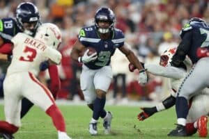 Kenneth Walker III #9 of the Seattle Seahawks rushes the football against the Arizona Cardinals