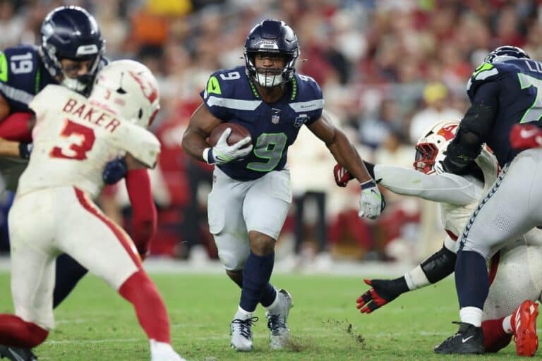 Kenneth Walker III #9 of the Seattle Seahawks rushes the football against the Arizona Cardinals