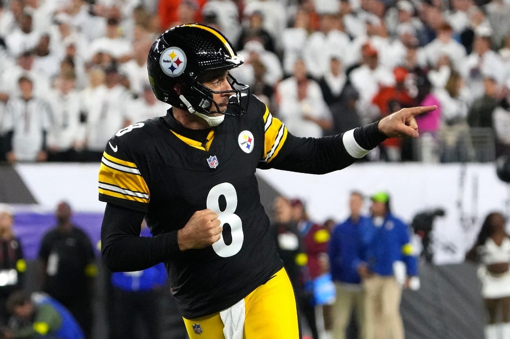 Aaron Rodgers #8 of the Pittsburgh Steelers celebrates after throwing a touchdown pass against the Cincinnati Bengals.