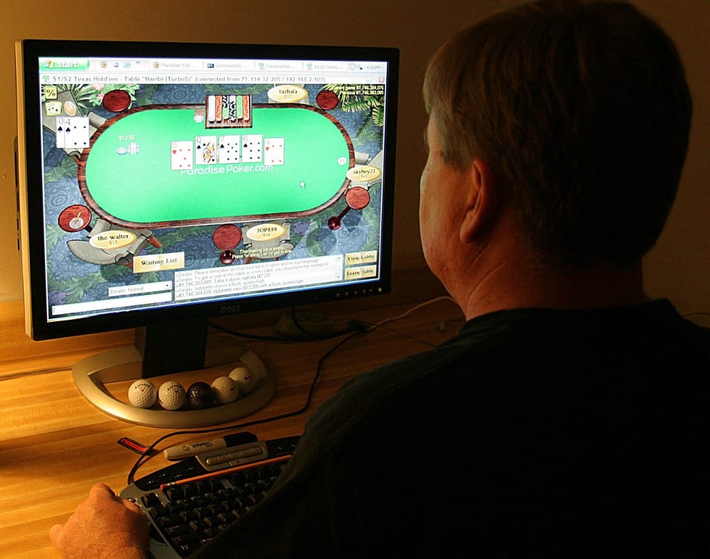 Man Playing Online Poker Online Casino