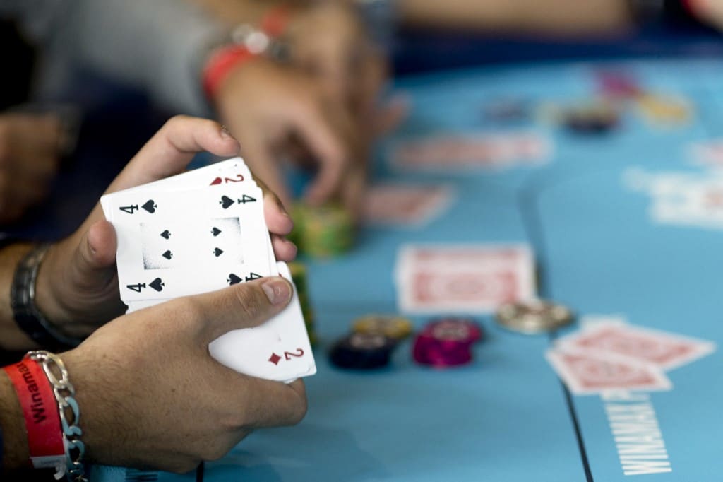 Poker Player Shuffles Cards