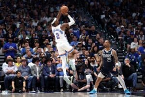Shai Gilgeous-Alexander #2 of the Oklahoma City Thunder shoots over P.J. Washington #25 of the Dallas Mavericks.