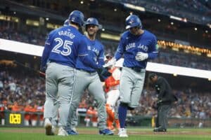 Ernie Clement #28 of the Toronto Blue Jays celebrates after hitting a three-run home run.