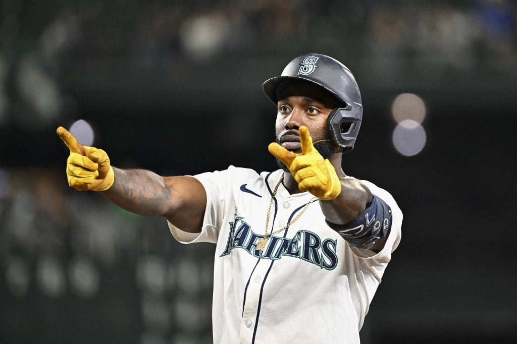 Randy Arozarena #56 of the Seattle Mariners gestures after hitting a two-run RBI single during the fifth inning against the Texas Rangers.