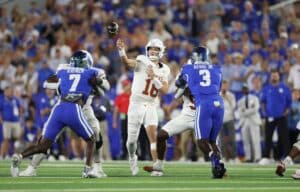 Arch Manning #16 of the Texas Longhorns throws a pass against the Kentucky Wildcats