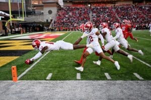The cover for this College football picks week 11 article shows Devan Boykin #12 of the Indiana Hoosiers returns a fumble for a touchdown in the third quarter against the Maryland Terrapins.