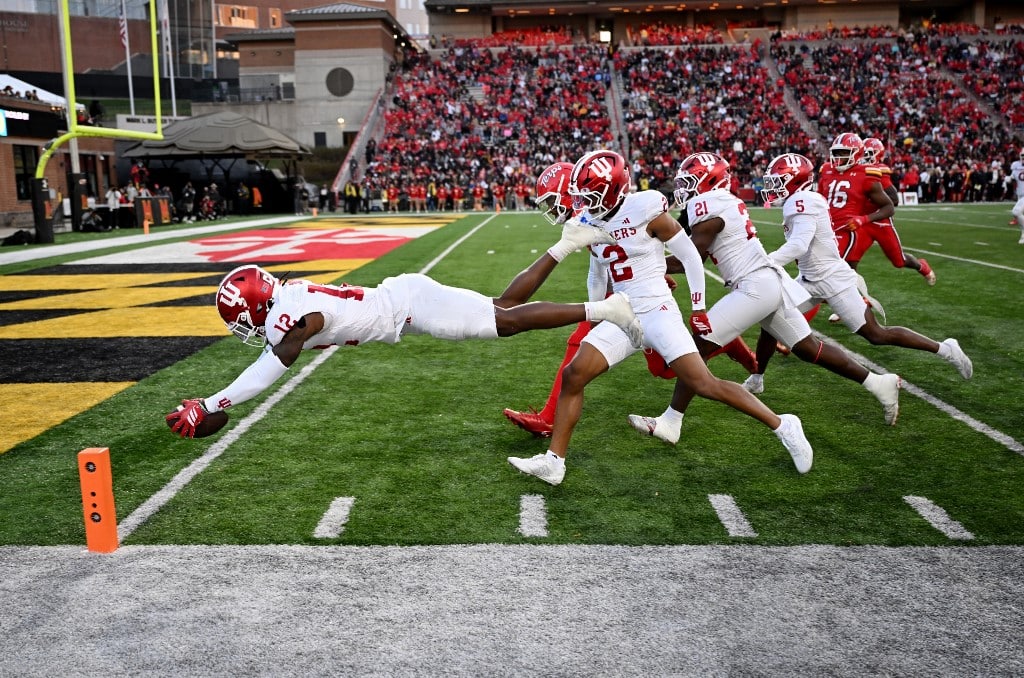 The cover for this College football picks week 11 article shows Devan Boykin #12 of the Indiana Hoosiers returns a fumble for a touchdown in the third quarter against the Maryland Terrapins.