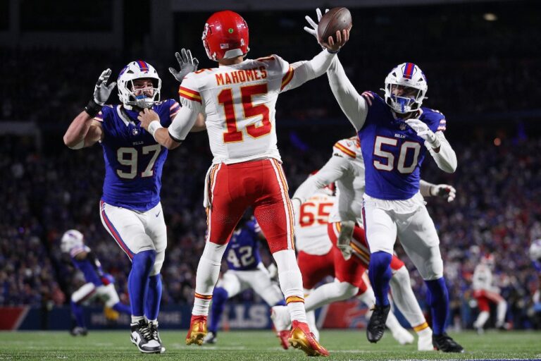 Kansas City Chiefs v Buffalo Bills - Oddstrader - Oddstrader The cover for this NFL picks week 11 article shows Patrick Mahomes #15 of the Kansas City Chiefs throwing as Joey Bosa #97 and Greg Rousseau #50 of the Buffalo Bills defend.
