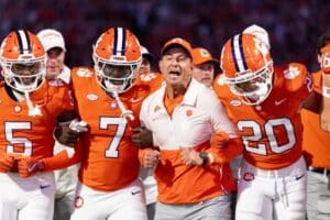 Head coach Dabo Swinney of the Clemson Tigers takes part in the Walk of Champions before the game against the Louisville Cardinals.