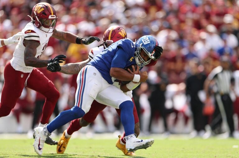 Russell Wilson #3 of the New York Giants carries the ball during the third quarter against the Washington Commanders.