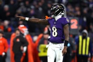 Lamar Jackson #8 of the Baltimore Ravens celebrates after a pass against the Cleveland Browns