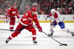 Dylan Larkin #71 of the Detroit Red Wings skates with the puck against the Montreal Canadiens.