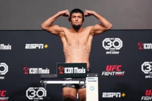Nursulton Ruziboev of Uzbekistan poses on the scale during the UFC Fight Night weigh-in at UFC Apex.