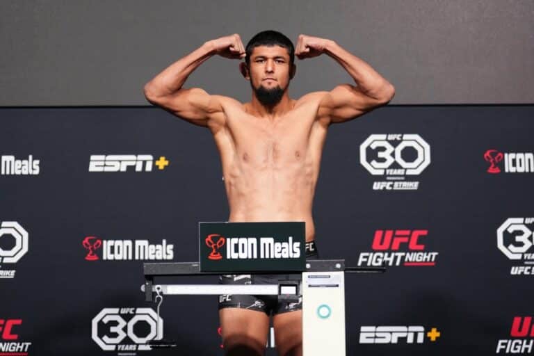 Nursulton Ruziboev of Uzbekistan poses on the scale during the UFC Fight Night weigh-in at UFC Apex.