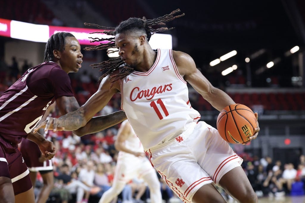Joseph Tugler #11 of the Houston Cougars drives to the basket as Jamarion Davis-Fleming #0 of the Mississippi State Bulldogs defends. March Madness odds article.