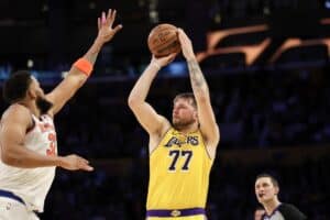 Luka Doncic of the Los Angeles Lakers, one of our top NBA player props today, shoots the ball against the New York Knicks.