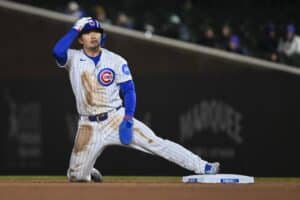Seiya Suzuki of the Chicago Cubs steals second base during the game against the Texas Rangers.