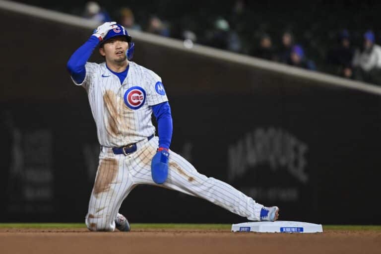 Seiya Suzuki of the Chicago Cubs steals second base during the game against the Texas Rangers.