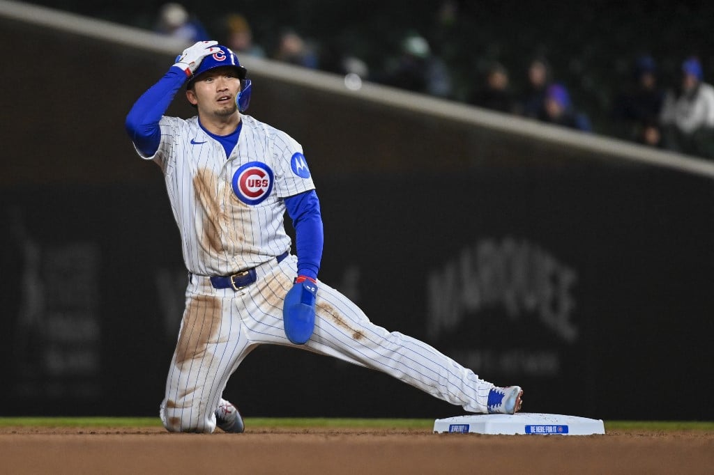 Seiya Suzuki of the Chicago Cubs steals second base during the game against the Texas Rangers.