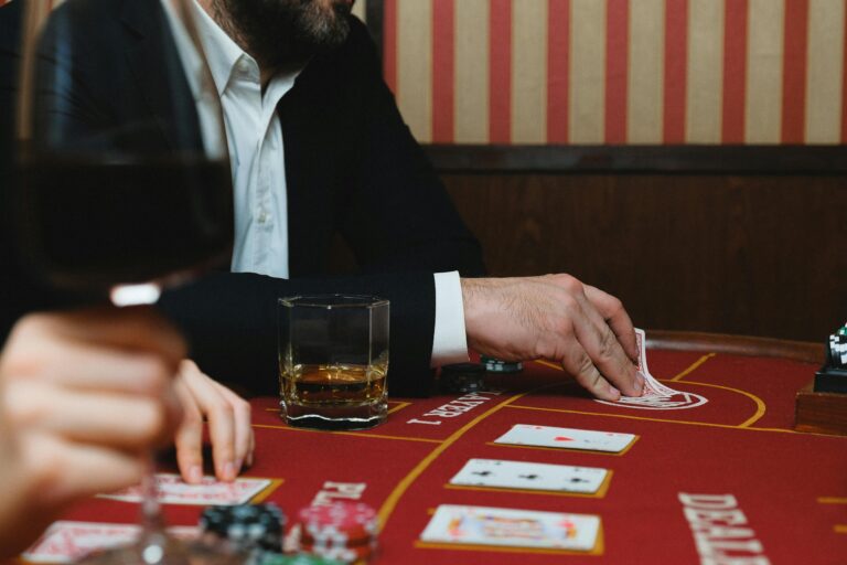man playing poker at a casino or card room