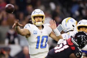 Justin Herbert #10 of the Los Angeles Chargers throws a pass against the Houston Texans