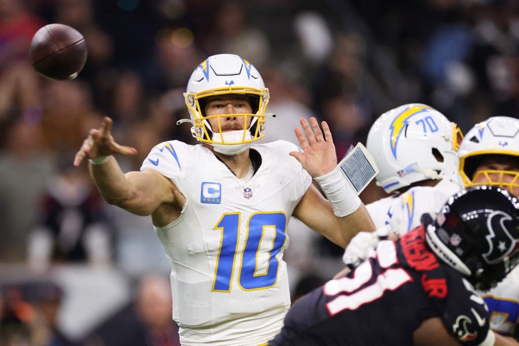 Justin Herbert #10 of the Los Angeles Chargers throws a pass against the Houston Texans