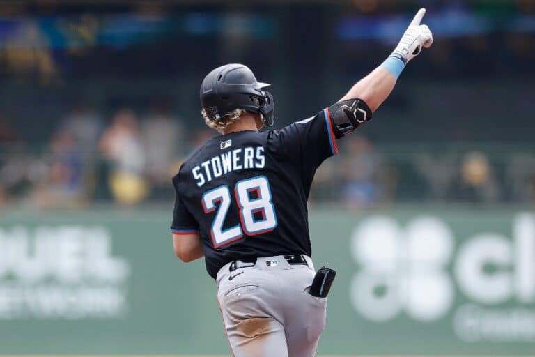 Kyle Stowers #28 of the Miami Marlins rounds first base after hitting a solo home run in the third inning against the Milwaukee Brewers.