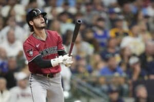 Blaze Alexander #9 of the Arizona Diamondbacks watches his two-run home run against the Milwaukee Brewers