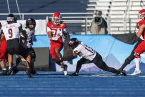 Running back Bryson Donelson #26 of the Fresno State Bulldogs breaks through a hole during the second half of the Famous Idaho Potato Bowl against the Northern Illinois Huskies
