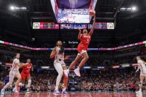 Kelsey Mitchell of the Indiana Fever shoots the ball against Kiki Iriafen of the Washington Mystics during the second half