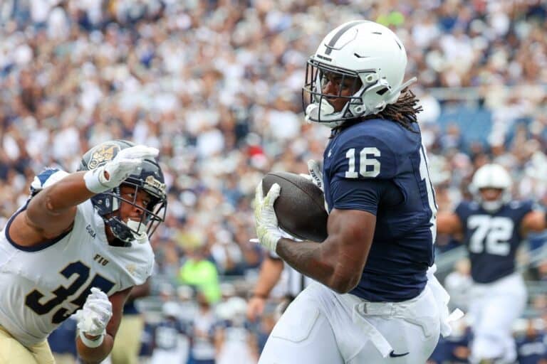 Khalil Dinkins #16 of the Penn State Nittany Lions scores a touchdown against Josiah Taylor #35 of the FIU Panthers