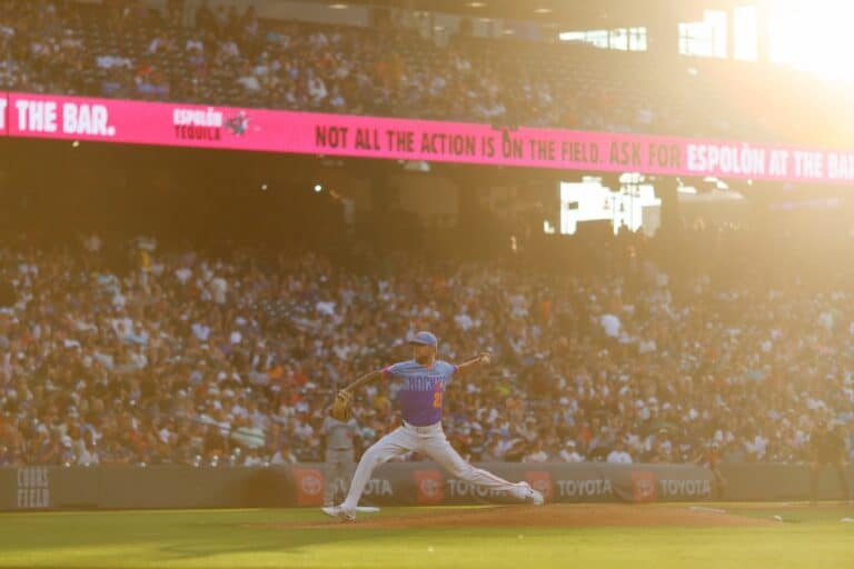 Relief pitcher Kyle Freeland #21 of the Colorado Rockies delivers a pitch to home plate against the Minnesota Twins