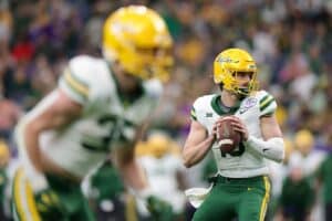 Sawyer Robertson #13 of the Baylor Bears drops back to pass the ball against the LSU Tigers.