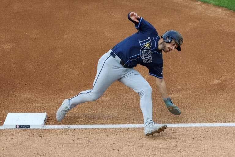 Brandon Lowe #8 of the Tampa Bay Rays slips at third base during the fourth inning against the New York Yankees.