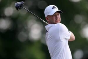 Daniel Berger of the United States plays his shot from the first tee during the second round of the Travelers Championship 2025.