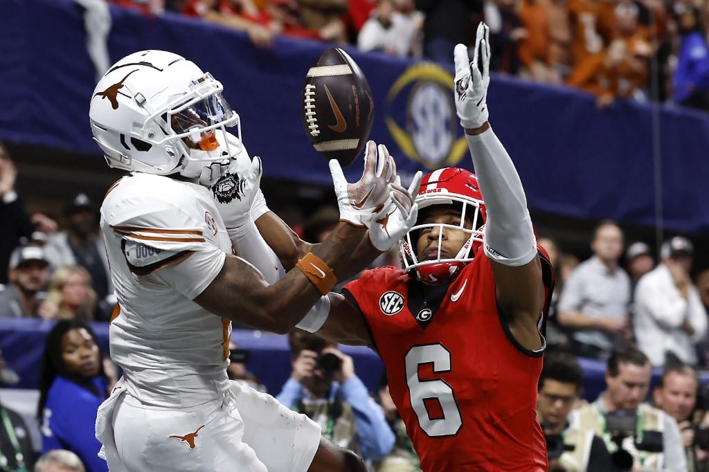 Daylen Everette #6 of the Georgia Bulldogs breaks up a pass intended for Matthew Golden #2 of the Texas Longhorns during overtime of the 2024 SEC Championship.
