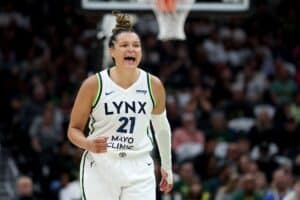 Kayla McBride #21 of the Minnesota Lynx reacts after a basket against the Seattle Storm.