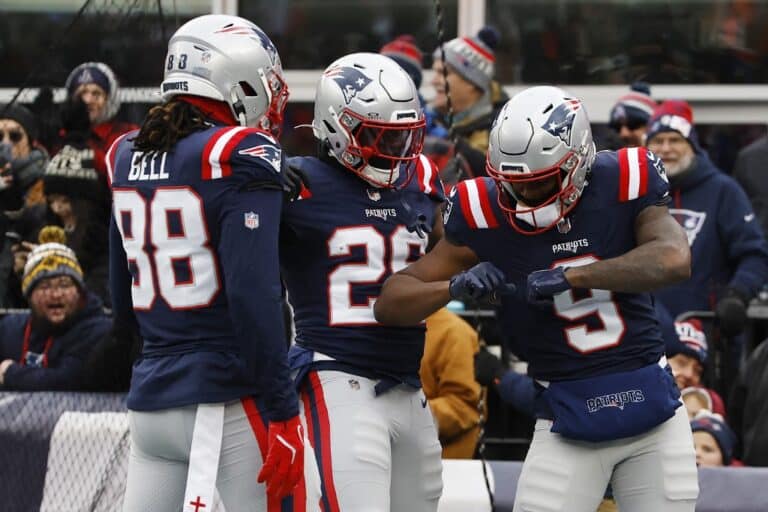 Kayshon Boutte #9 of the New England Patriots celebrates with teammates after scoring a touchdown against the Buffalo Bills.