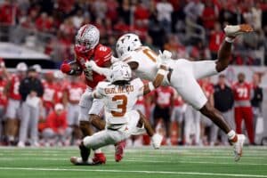 The Ohio State Buckeyes and the Texas Longhorns at play during the Goodyear Cotton Bowl.