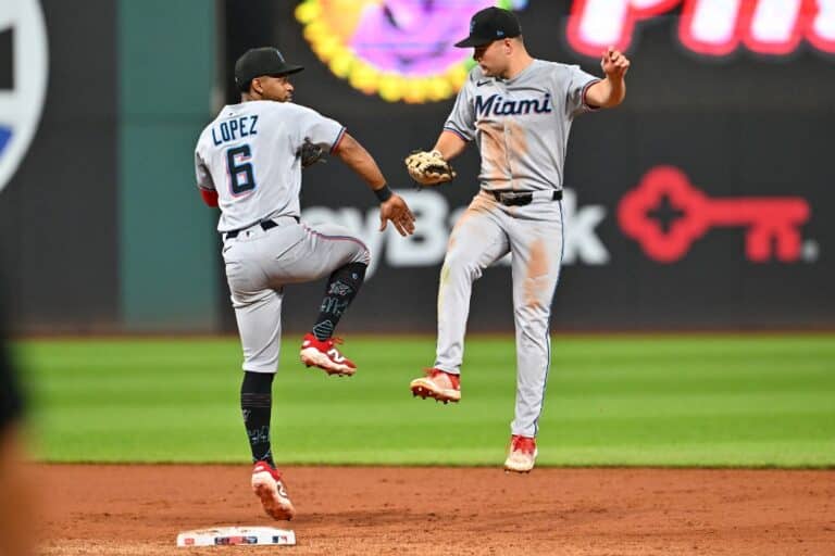 Otto Lopez and Jakob Marsee of the Miami Marlins celebrate after defeating the Cleveland Guardians.