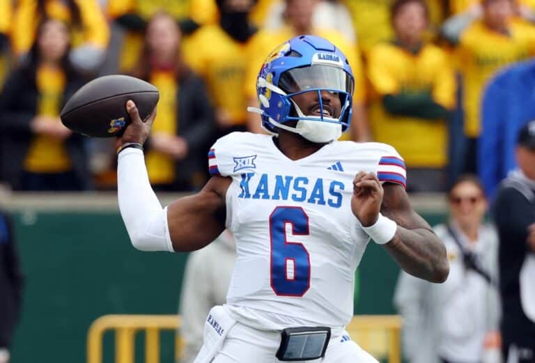 Quarterback Jalon Daniels #6 of the Kansas Jayhawks throws a pass against the Kansas Jayhawks.