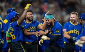 (L-R) Randy Arozarena #56, Eduard Bazardo #83, J.P. Crawford #3 and Cal Raleigh #29 of the Seattle Mariners celebrate after a game against the Texas Rangers.