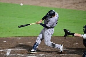 Trent Grisham #12 of the New York Yankees hits a single in the fifth inning against the Tampa Bay Rays.